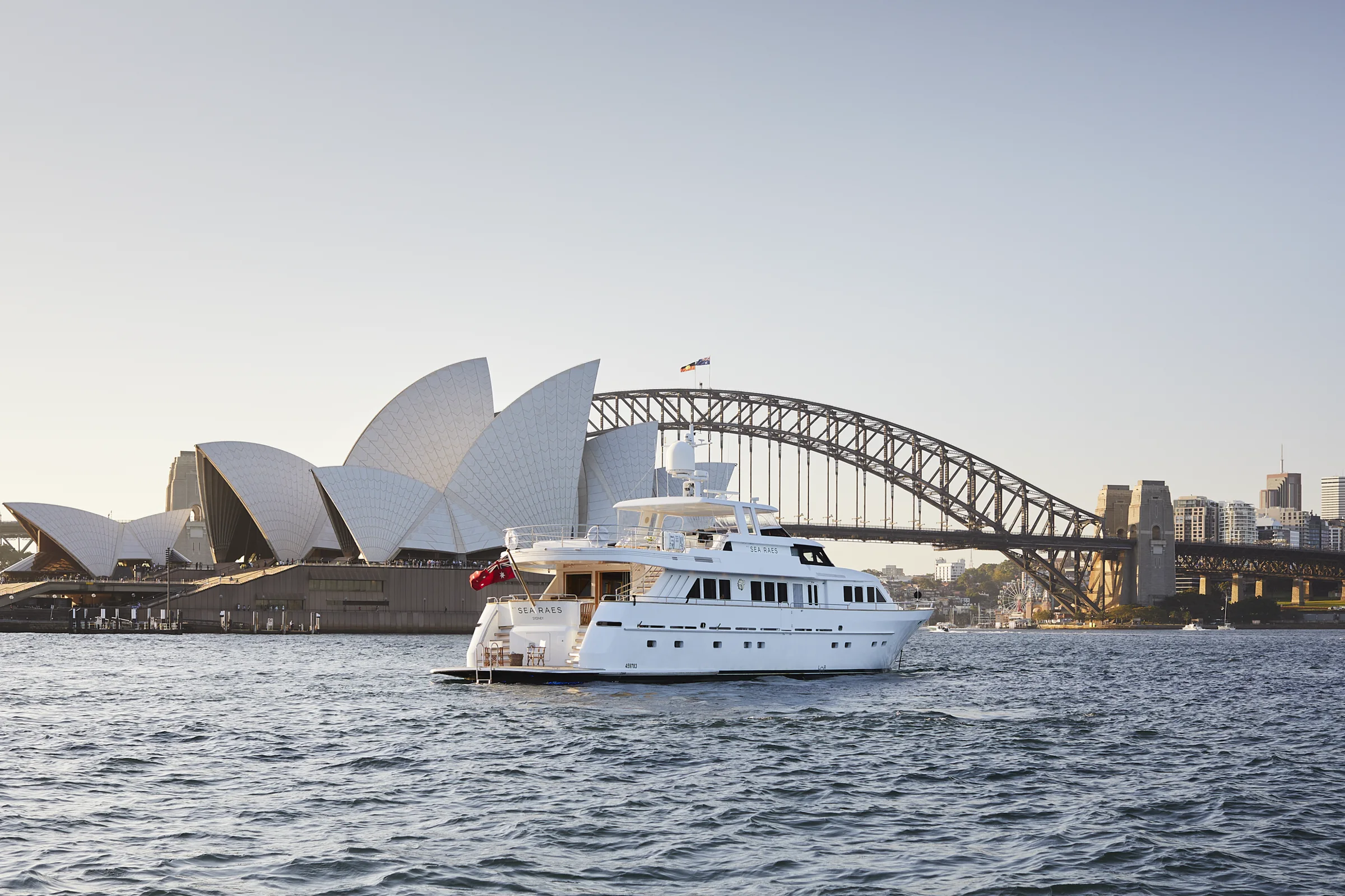 M/Y Sea Raes on Sydney Harbour with the Opera House and Harbour Bridge behind
